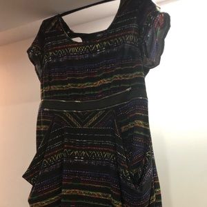 Unique black dress with zipper details.